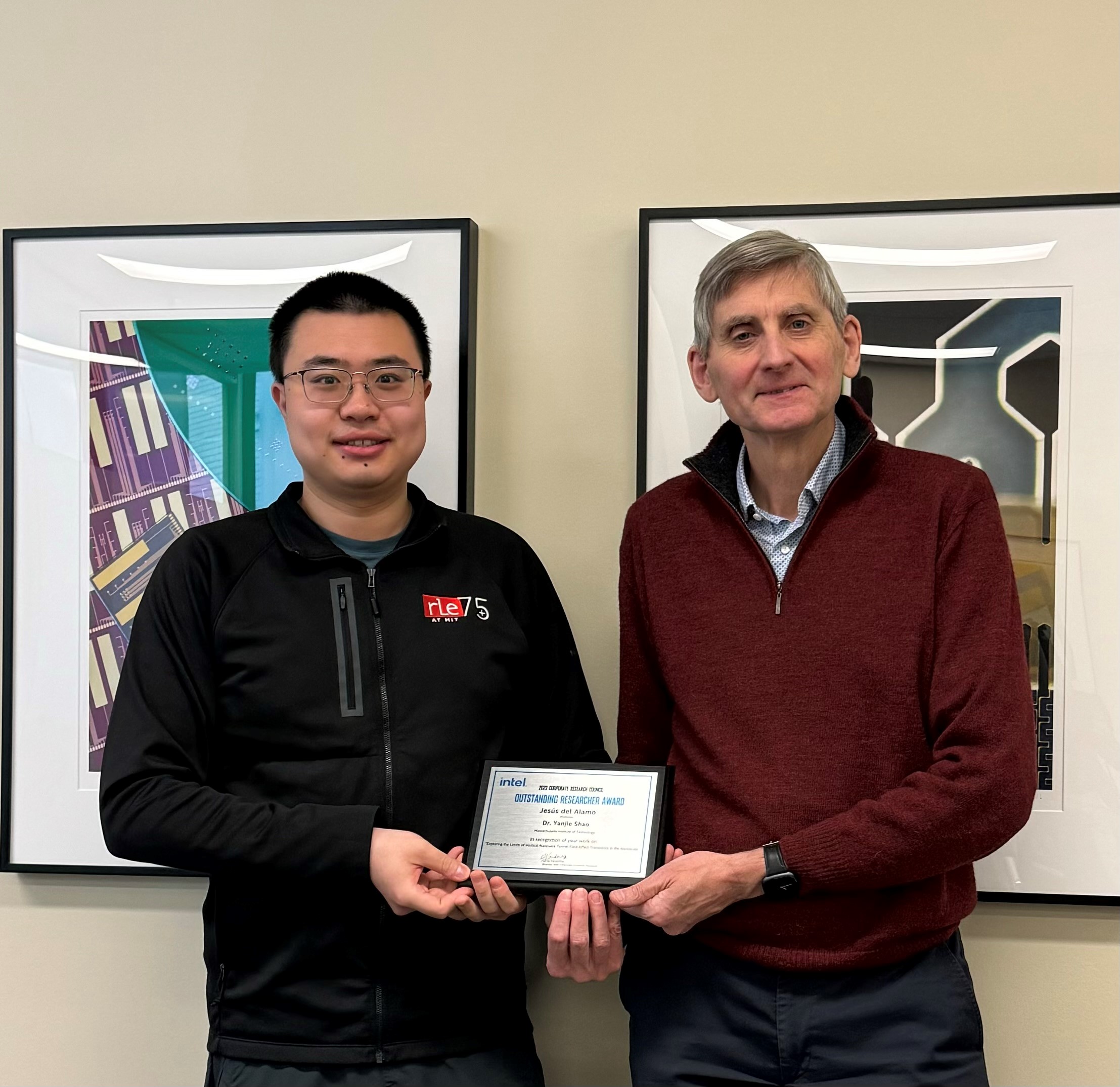 Yanjie shao and Jesus del Alamo stand with their award