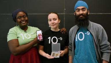Senior Stephanie Khaguli, junior Vlada Petrusenko, sophomore Anhad Sawhney, and sophomore Matthew Taylor (not photographed but appearing on Khaguli's phone) designed and fabricated a flexible graphene supercapacitor for solar energy storage.