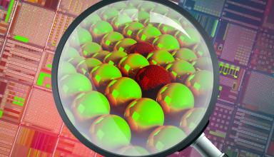 magnify glass looking at green and red balls