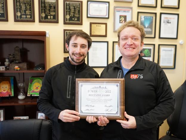 Alex Kachkine and Luis Fernando Velásquez-García pose with their award.