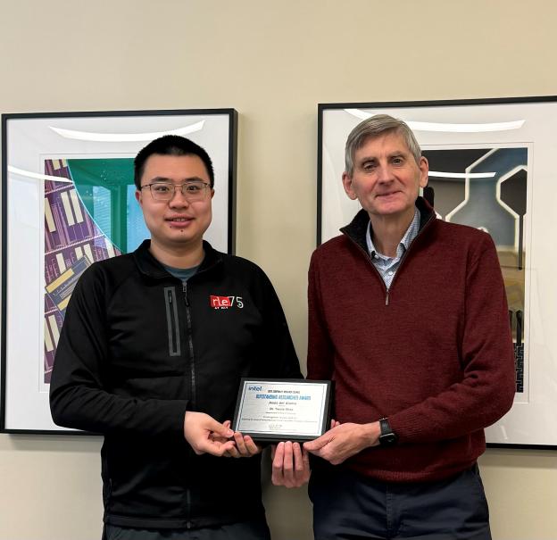 Yanjie shao and Jesus del Alamo stand with their award