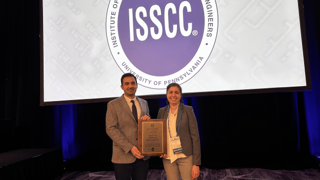 man and woman pose with award
