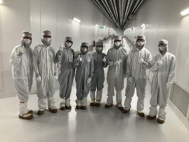 group of people in white suits 