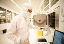 Assistant director for Fab.nano Jorg Scholvin prepares to load an 8-inch wafer into the Temescal FC-2800 e-beam evaporator inside MIT.nano’s cleanroom.