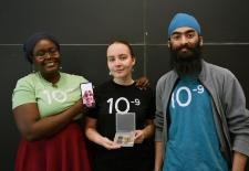 Senior Stephanie Khaguli, junior Vlada Petrusenko, sophomore Anhad Sawhney, and sophomore Matthew Taylor (not photographed but appearing on Khaguli's phone) designed and fabricated a flexible graphene supercapacitor for solar energy storage.