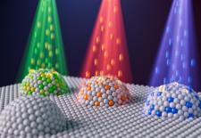 Artist’s representation of nanoparticles with different compositions created by combining two techniques: metal exsolution and ion irradiation.