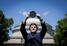 Pablo standing in front of MIT dome holding wafer