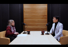 sally Kornbluth and song Han sit across each other at a table